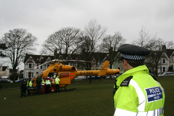 The injured cyclist is placed in the helicopter